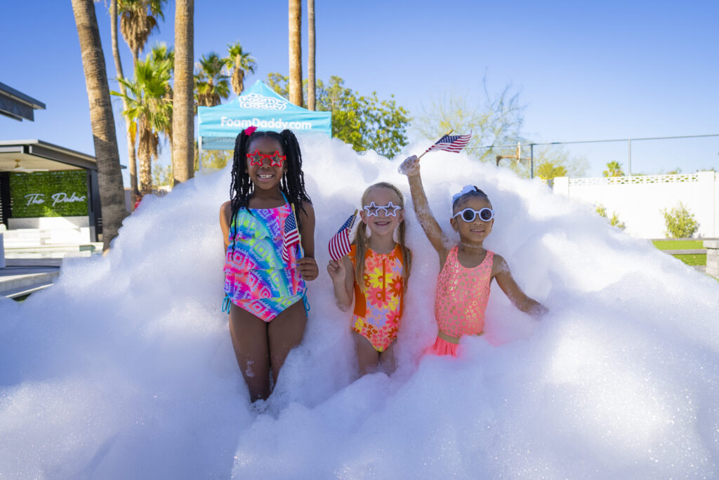 people enjoying a Blizzard Foam outdoor entertainment foam party in Houston Texas