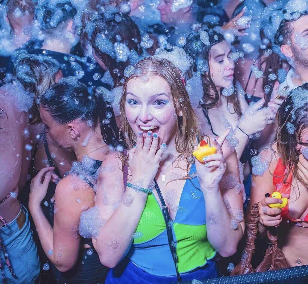 people enjoying a Blizzard Foam outdoor entertainment foam party in Houston Texas